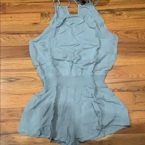 Light blue romper with pockets on the side